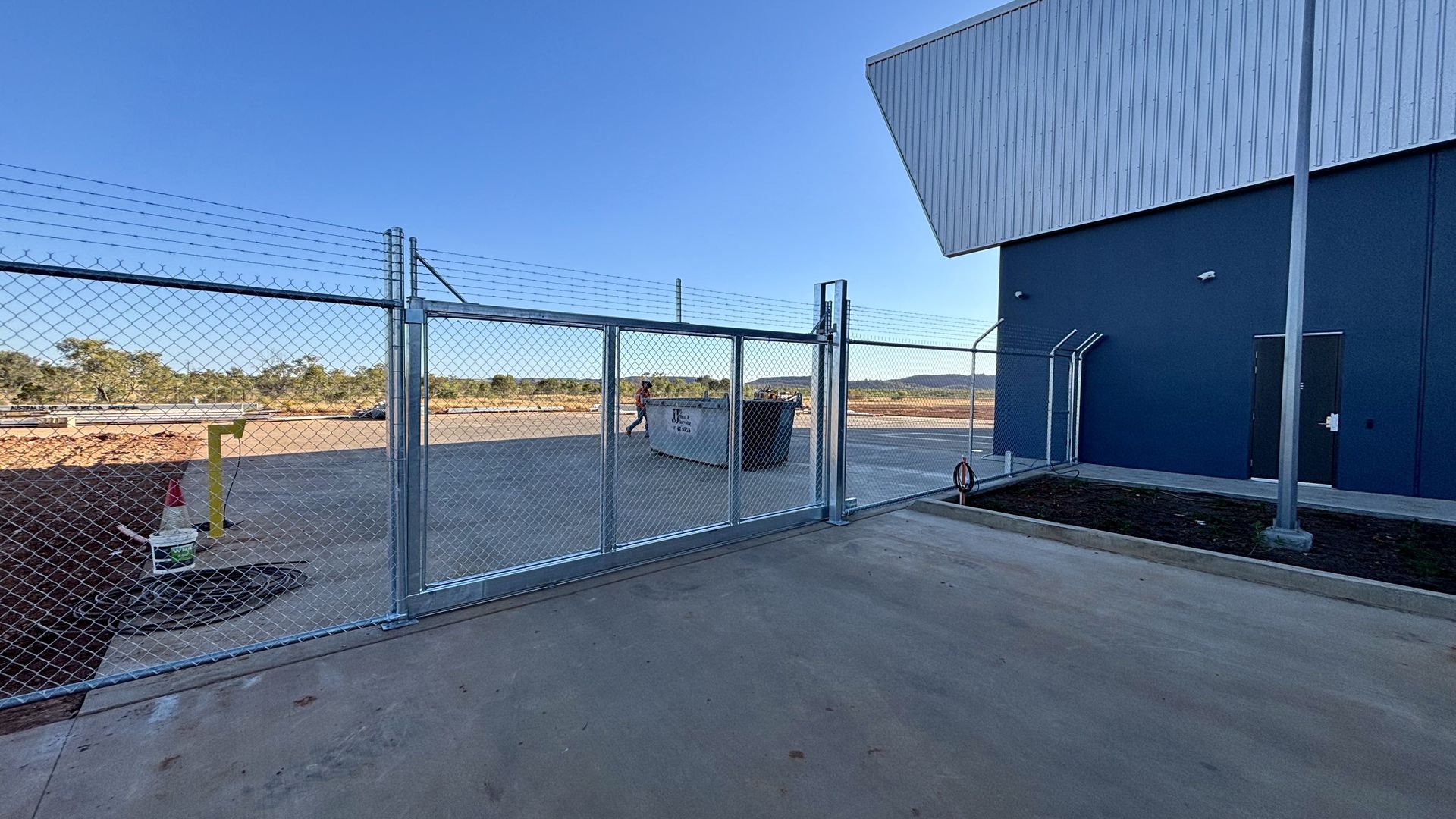Chain wire sliding gate at commercial building