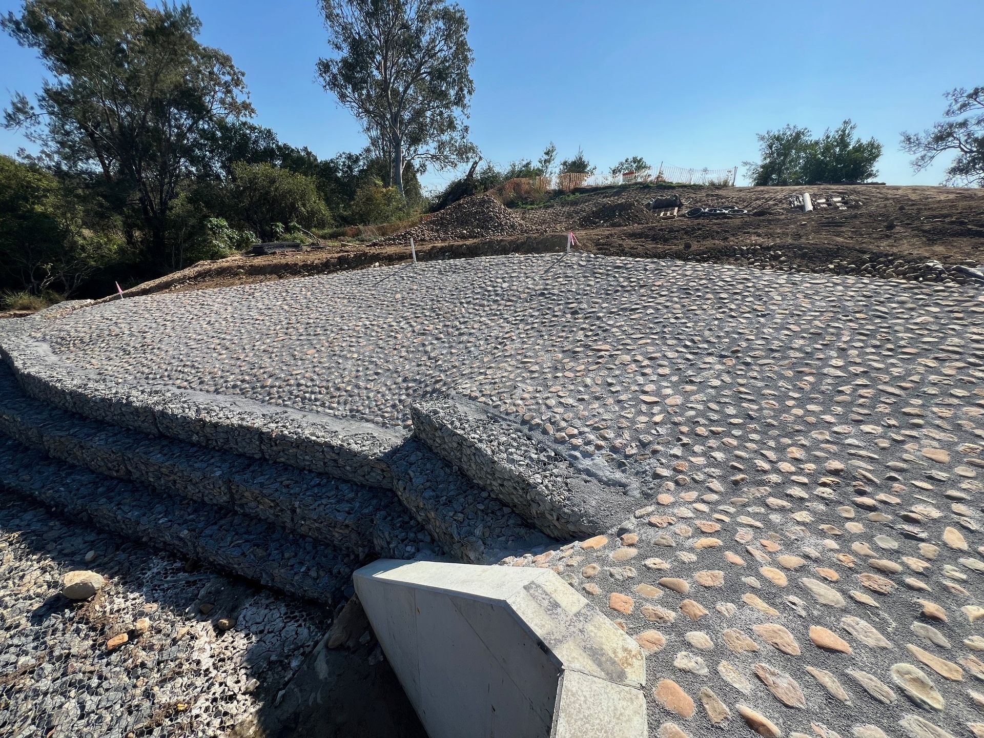 Providence stone pitching slope stabilisation with hand-placed natural stone